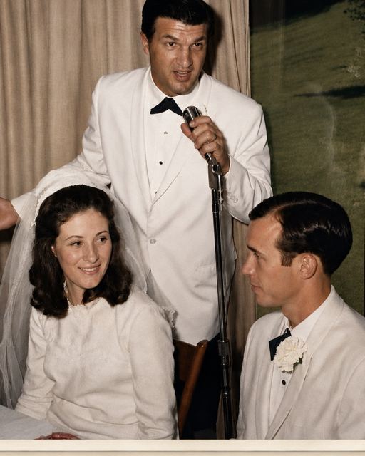 Russell and Peggy on their wedding day, as best man Earl "Chit" Chittenden gives his toast